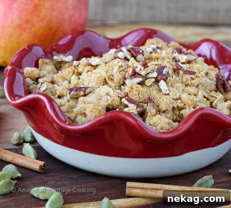 Another view of the baked Cardamom Pear Crisp, highlighting its golden color and inviting texture.