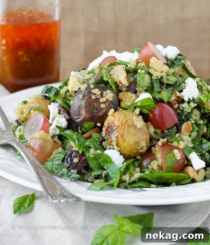 Vibrant Roasted Vegetable & Quinoa Chop 2 Vibrant Quinoa Roasted Vegetable Chopped Salad with Thai Chili Vinaigrette served in a large bowl.