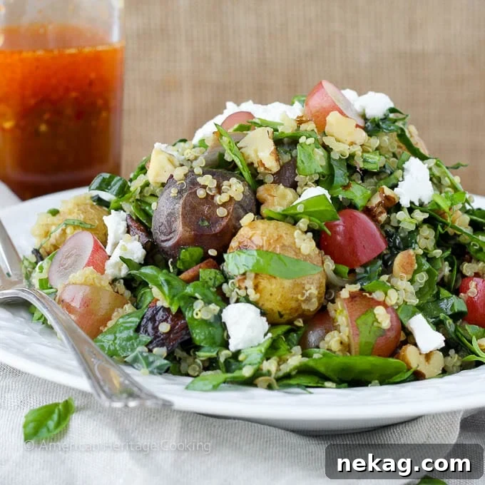 Vibrant Roasted Vegetable & Quinoa Chop 3 Close-up view of the ingredients in Quinoa Roasted Vegetable Chopped Salad including kale, quinoa, and grapes.