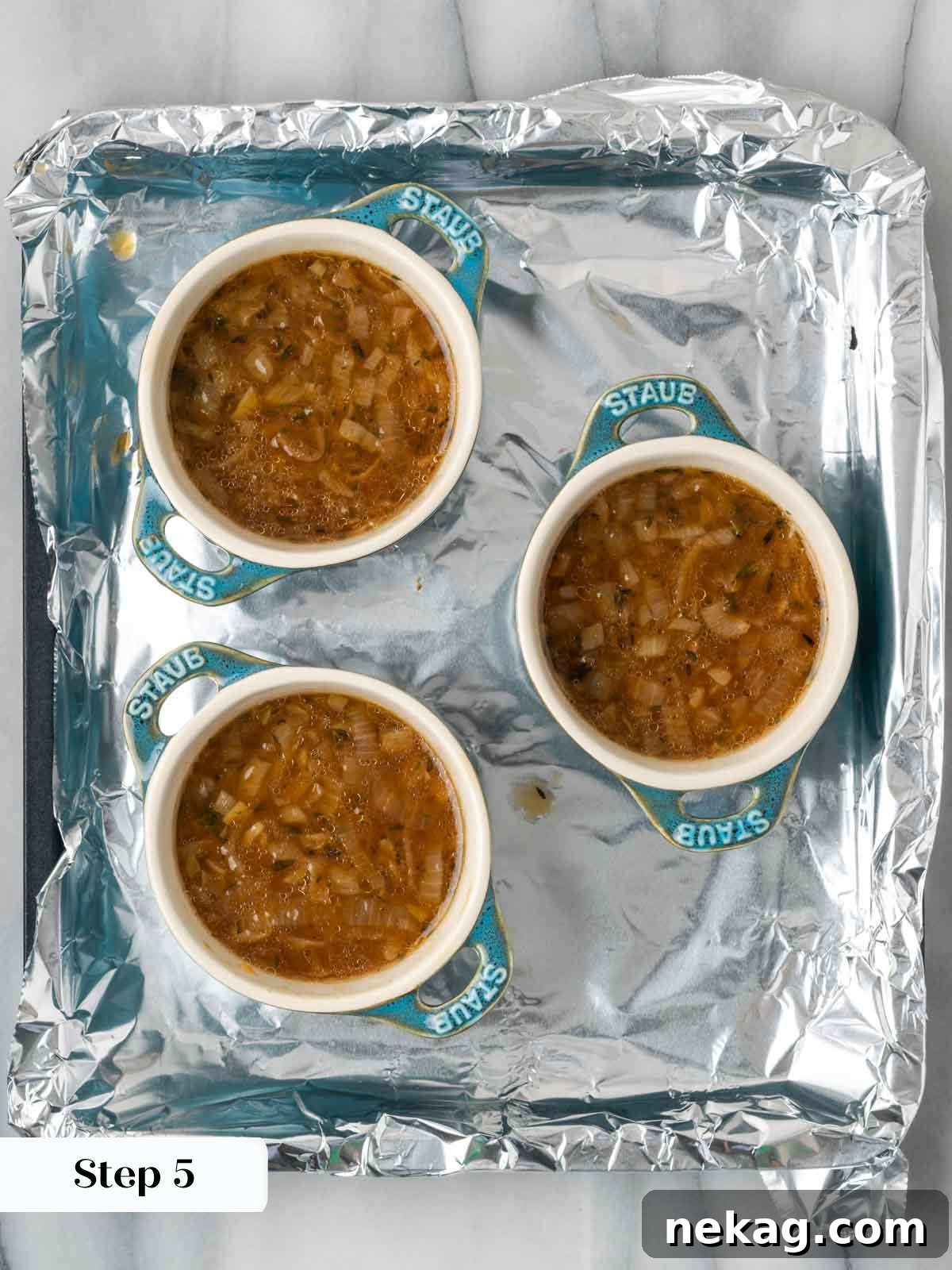 Quintessential French Onion Soup 8 portioning onion soup into ramekins, preparing for topping.