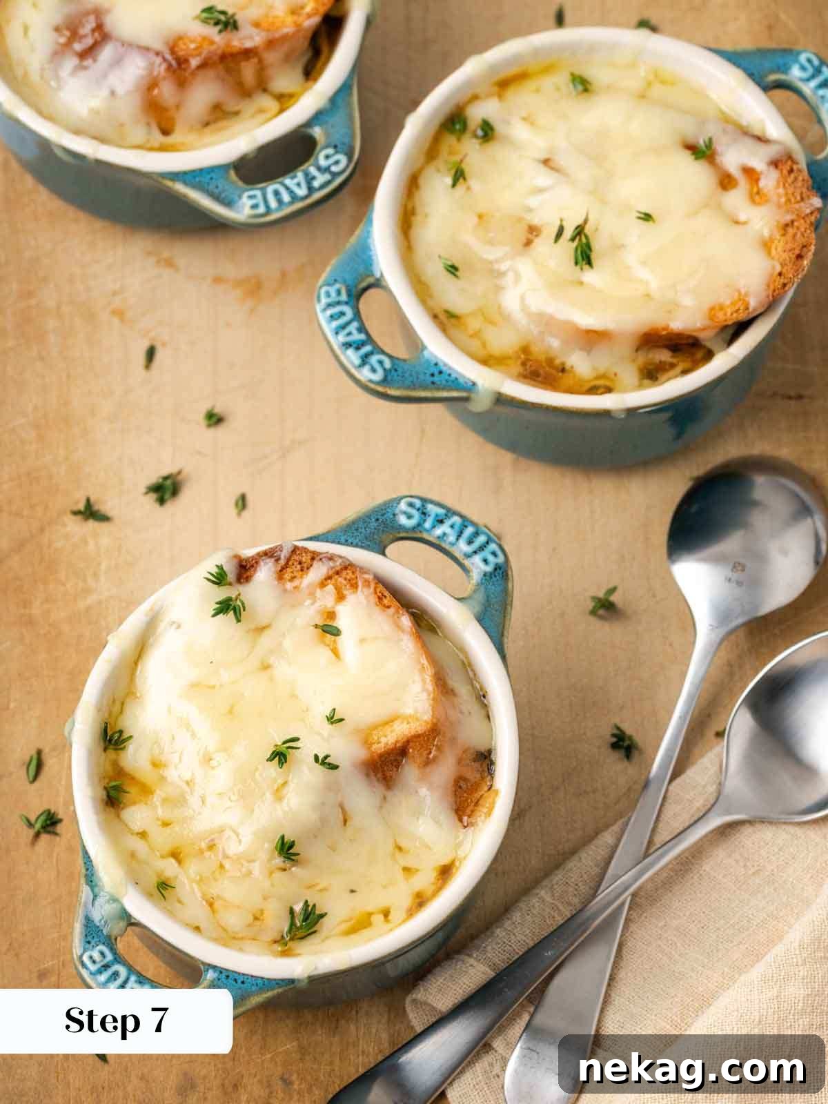 Quintessential French Onion Soup 10 baked french onion soup in 3 dishes, showcasing the final golden-brown cheese topping.