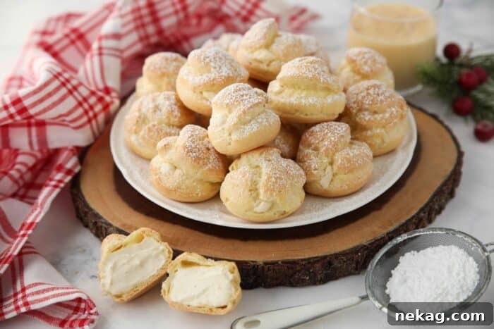 Holiday Eggnog Cream Puffs 14 Beautifully arranged cream puffs generously filled with whipped eggnog pastry cream, ready to be enjoyed.