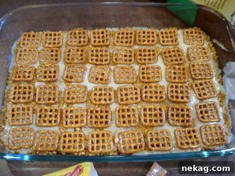 Caramel Pretzel Dream Bars 5 Baked Caramel Pretzel Magic Bars neatly sliced and arranged