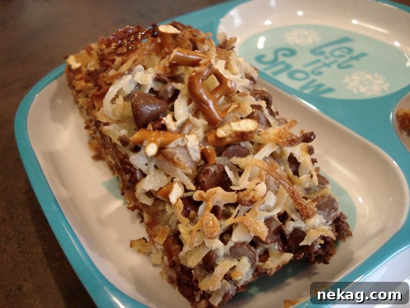 Caramel Pretzel Dream Bars 8 Close-up of a single Caramel Pretzel Magic Bar showing texture