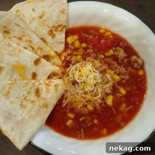 Tin Can Taco Soup with a spoon, ready to be enjoyed.
