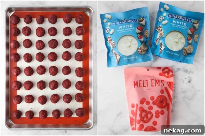 Decadent Red Velvet Bites 6 Perfectly shaped red velvet cake truffles neatly arranged on a baking sheet, with bags of white chocolate and red candy melts in the background, ready for coating.