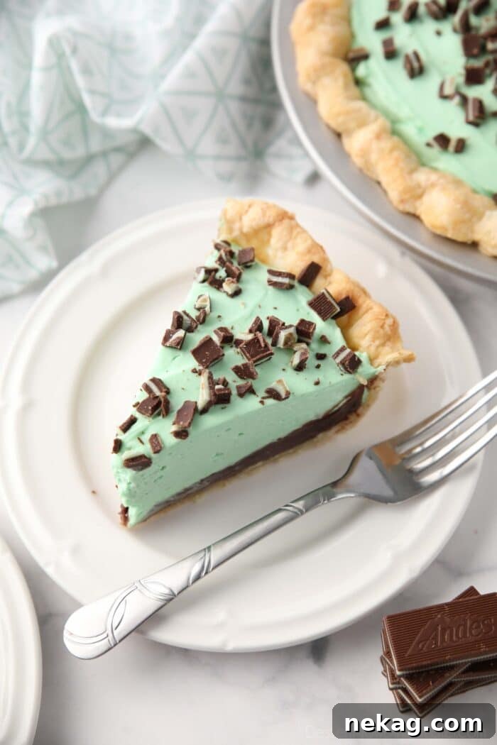Decadent Chocolate Mint Dream 4 Slice of chocolate mint pie on a plate with a fork.