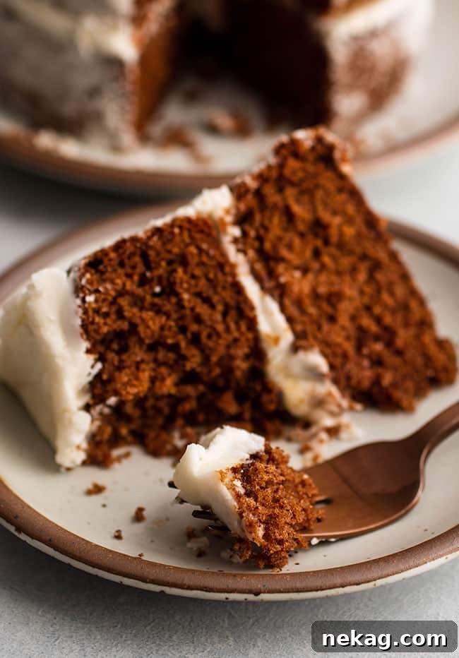 A beautifully decorated apple butter spice cake, tempting with its rich colors and smooth frosting.