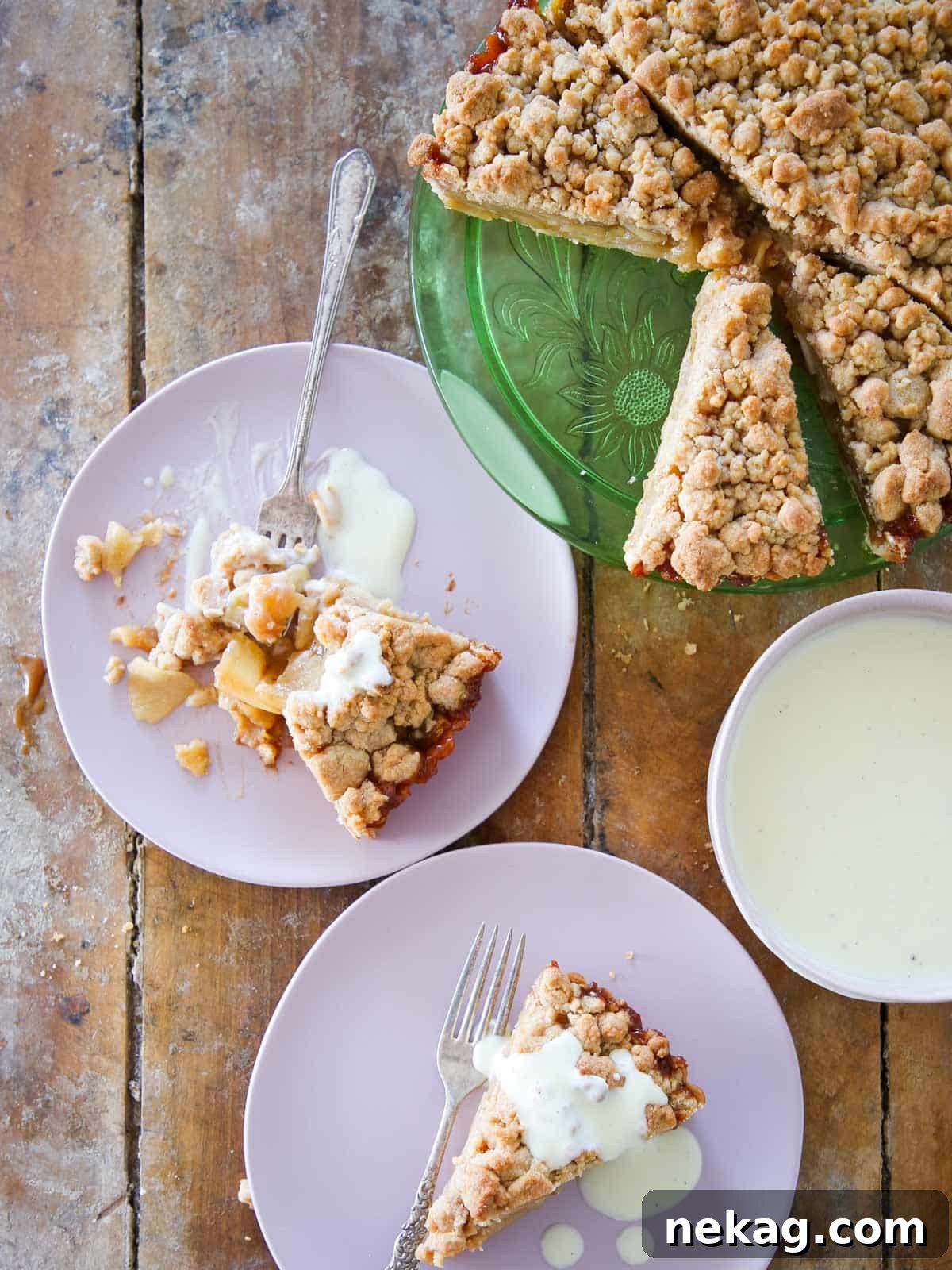 A stunning caramel apple tart, beautifully arranged on a rustic wooden board, ready to be served as a decadent dessert.