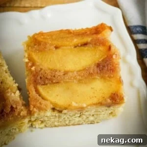 A close-up of the sticky, caramel apple topping of an apple upside-down cake.