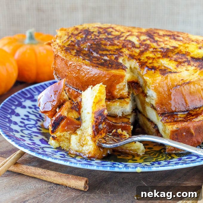Close-up of Pumpkin Spice French Toast, a holiday breakfast for two, garnished with powdered sugar.