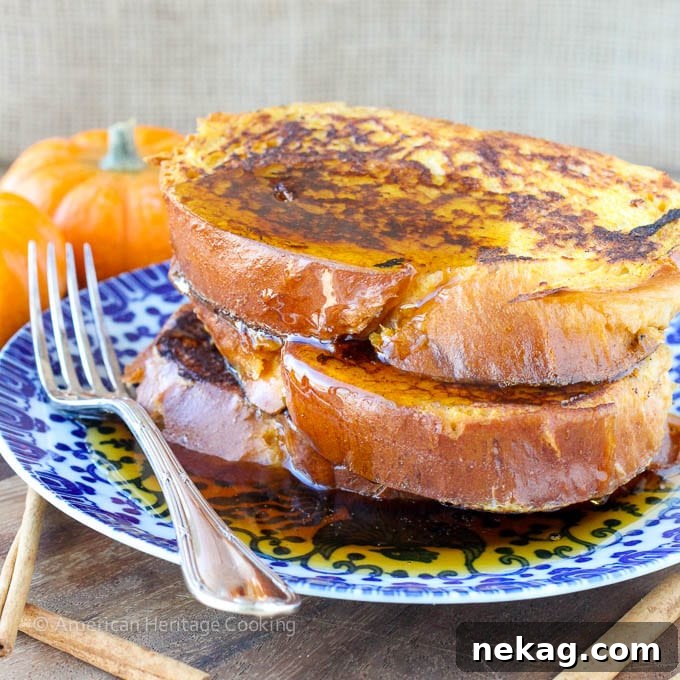 Stack of Pumpkin Spice French Toast on a plate, ready to be served for a cozy morning.