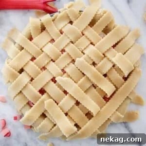 Weaving a Perfect Pie Crust Lattice 15 lattice pie crust on strawberry rhubarb pie.