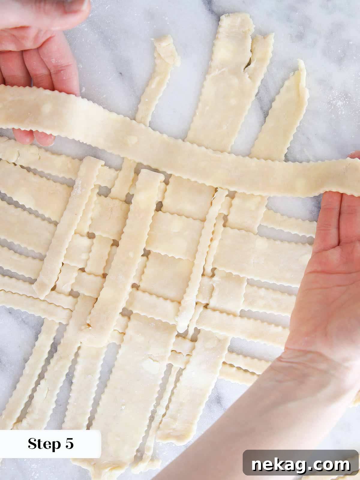 Weaving a Perfect Pie Crust Lattice 8 laying piece of pie dough onto lattice.