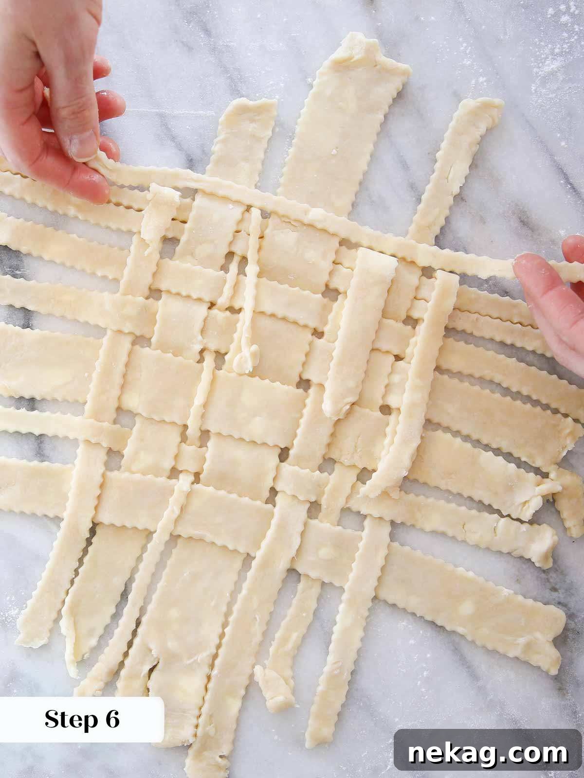 Weaving a Perfect Pie Crust Lattice 9 latticing pie crust on marble.