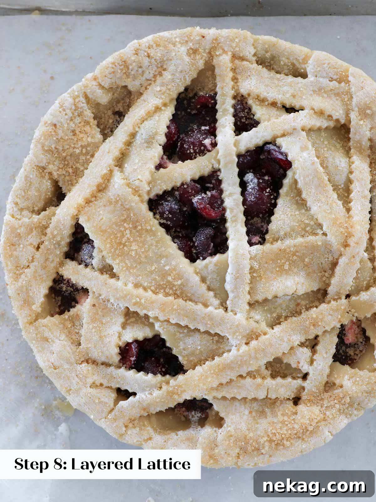 Weaving a Perfect Pie Crust Lattice 10 ready to bake pie with asymmetrical crust and turbinado sugar.