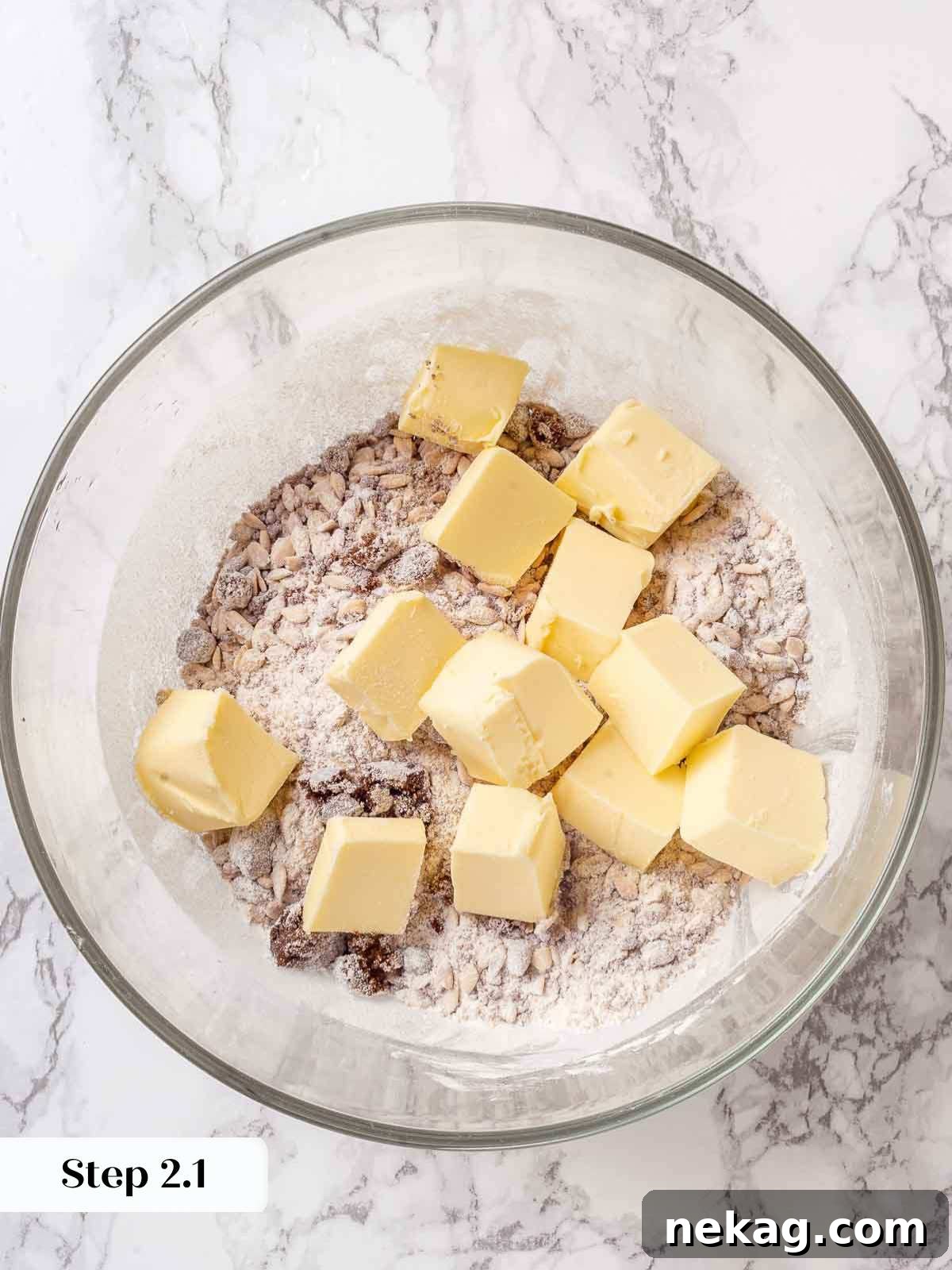 Effortless Golden Apple Crisp 6 Dry ingredients for apple crisp topping (brown sugar, flour, oats) in a bowl before butter is added.