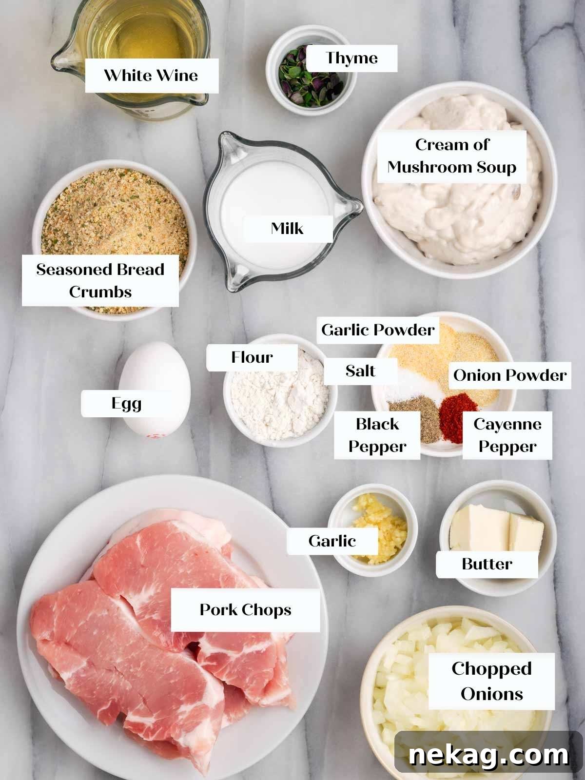 Creamy Mushroom Smothered Pork Chops 4 All the fresh ingredients for making pork chops laid out on a marble surface.