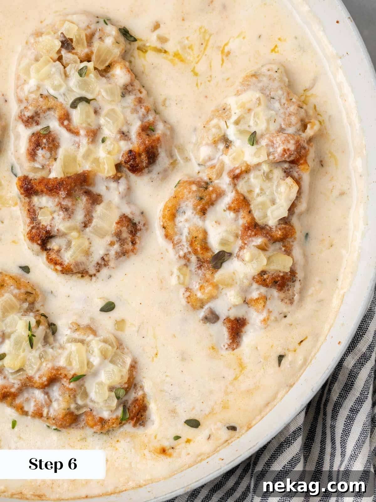 Creamy Mushroom Smothered Pork Chops 10 The fully finished baked pork chops with cream of mushroom soup, bubbly and delicious in the pan.