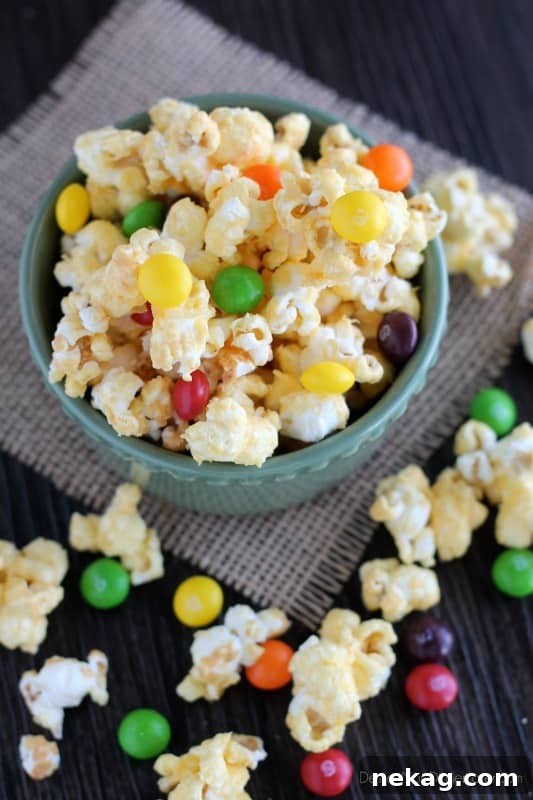 Freshly baked golden Pot of Gold Popcorn cooling on a foil-lined baking sheet.