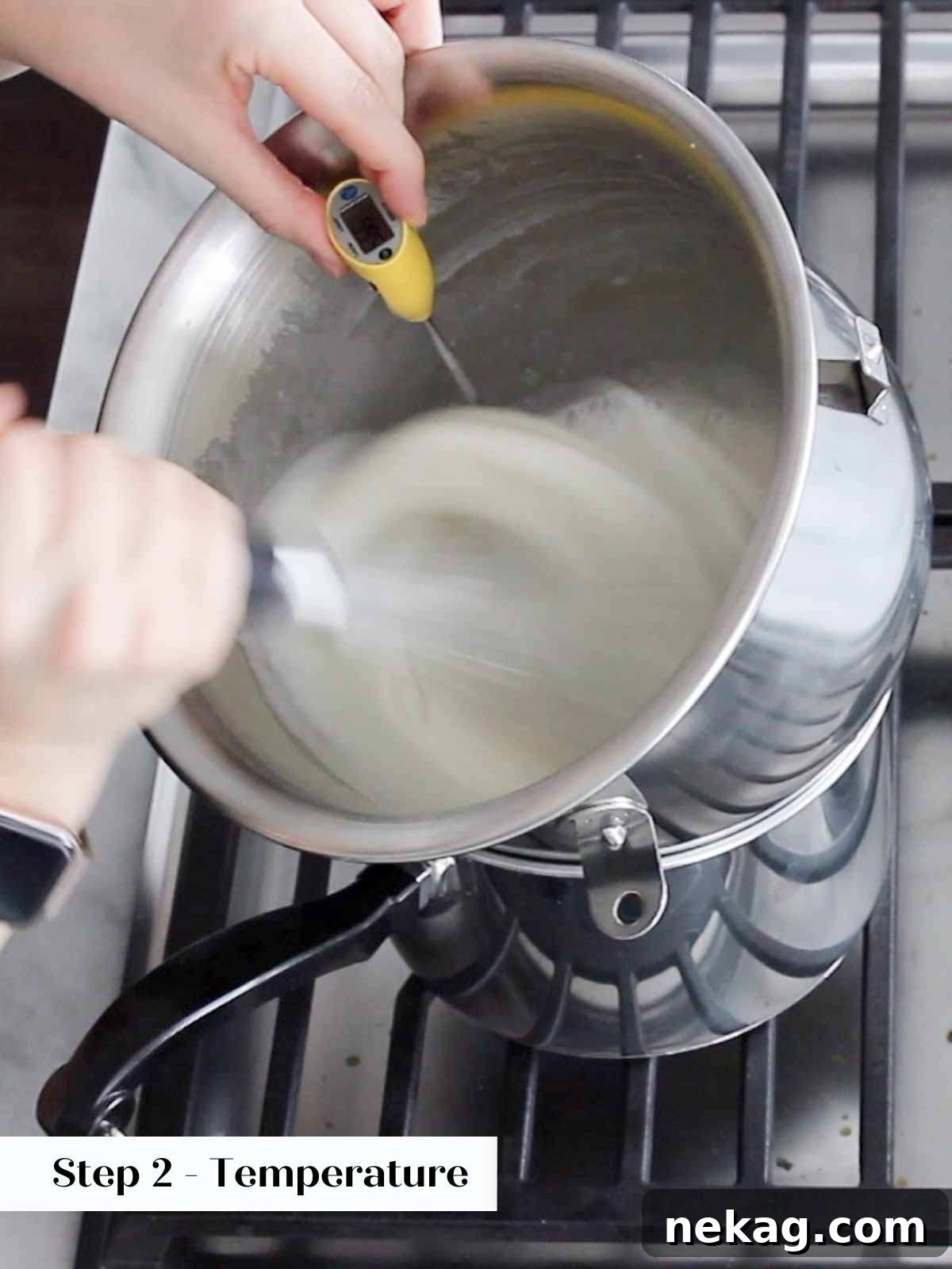 Heavenly Marshmallow Frosting 5 Checking the temperature of whipping Swiss meringue with an instant-read thermometer.