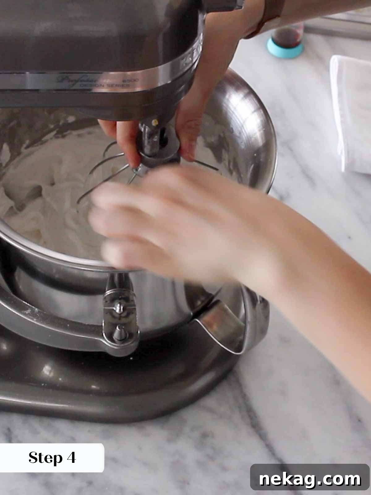 Heavenly Marshmallow Frosting 6 Whipping glossy meringue to stiff peaks in a stand mixer with a whisk attachment.