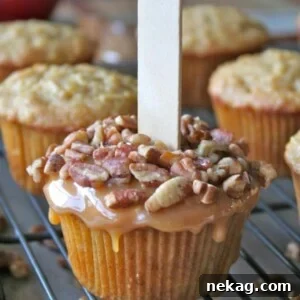 Caramel Apple Cupcakes topped with nuts and caramel