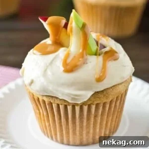 Caramel Apple Cupcakes with apple slices and caramel drizzle