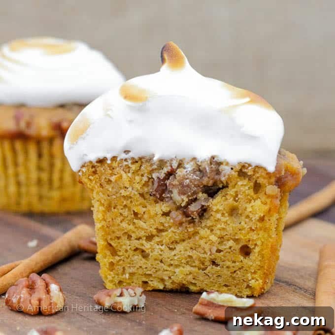 Batch of Sweet Potato Casserole Cupcakes cooling on a wire rack