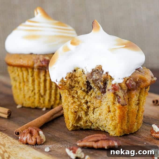 Side view of a Sweet Potato Casserole Cupcake revealing the pecan topping inside
