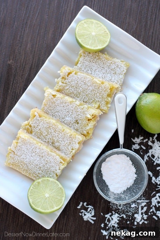 Zesty Coconut-Lime Dream Bars 4 Freshly baked Coconut Key Lime Bars cooling in a baking dish, ready for slicing
