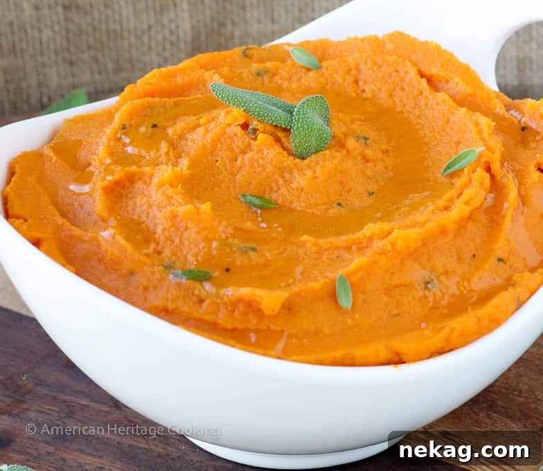 Creamy Brown Butter Sage Mashed Sweet Potatoes in a serving bowl, garnished with fresh sage leaves.