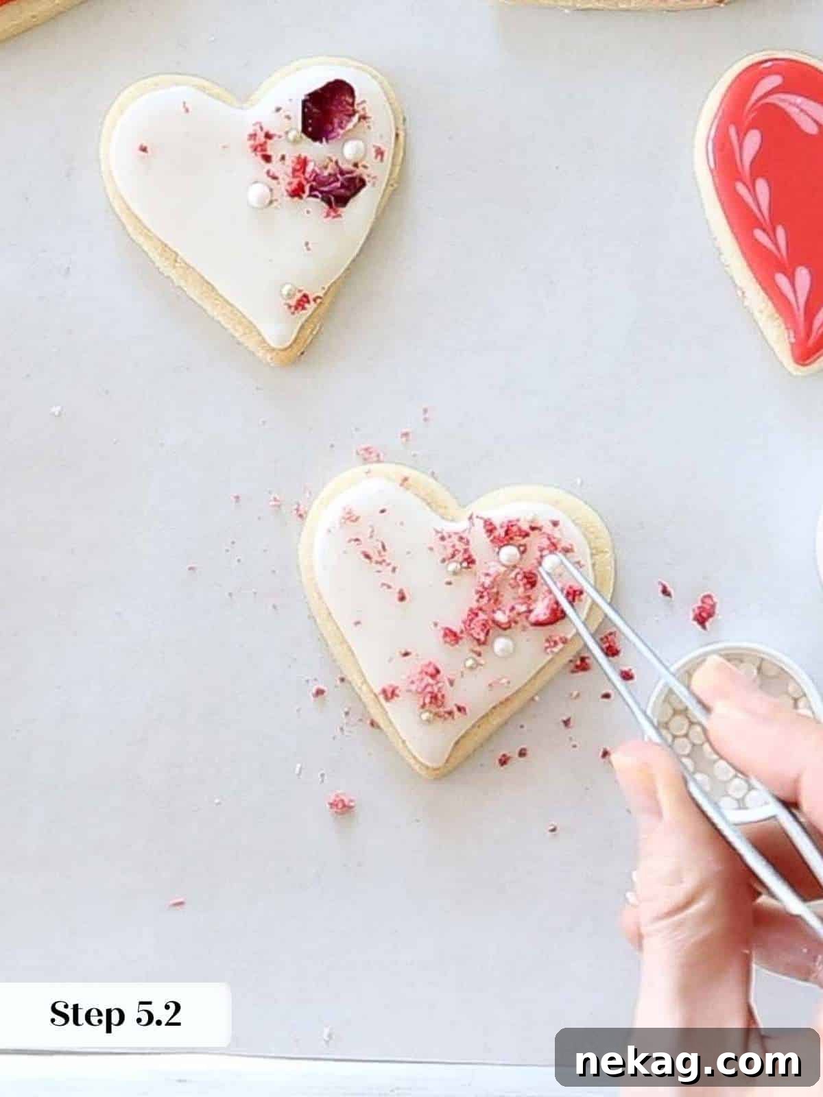Rich Chocolate Sugar Cookies 12 Decorating sugar cookie hearts with delicate sugar pearls for an elegant touch.