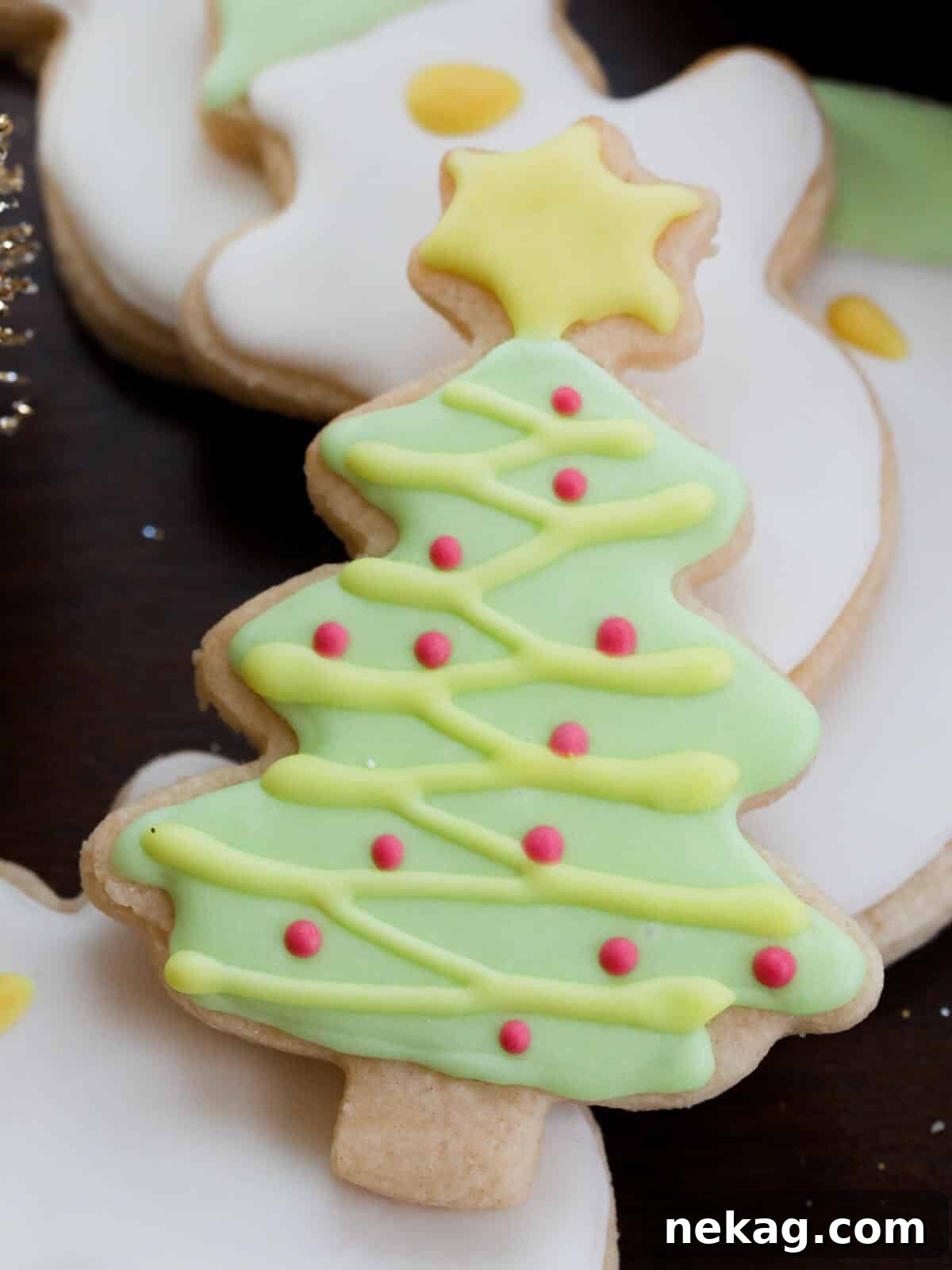 Flawless Royal Icing Made Easy with Meringue Powder 5 Christmas tree decorated sugar cookie.