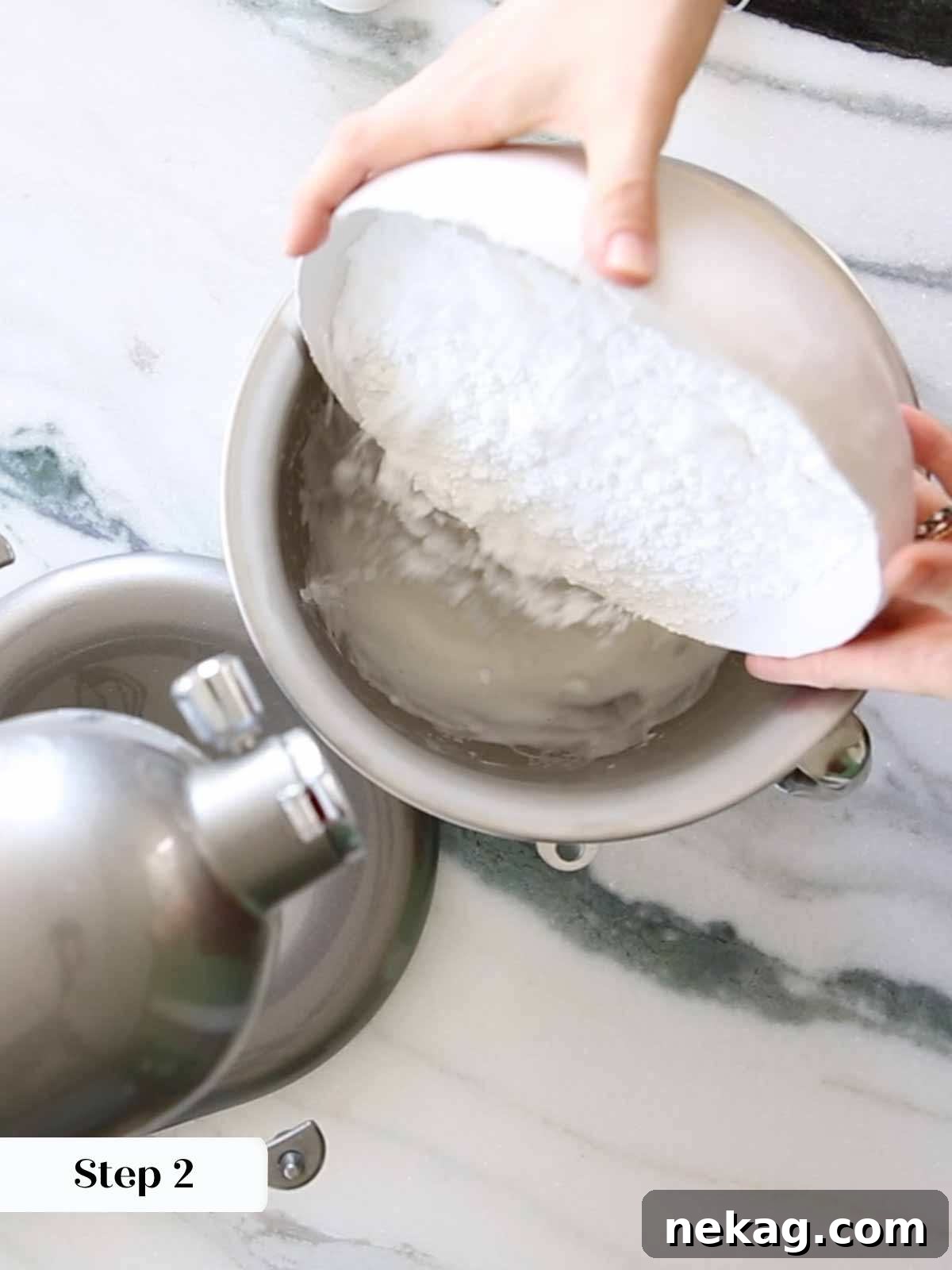 Flawless Royal Icing Made Easy with Meringue Powder 8 adding powdered sugar to meringue.