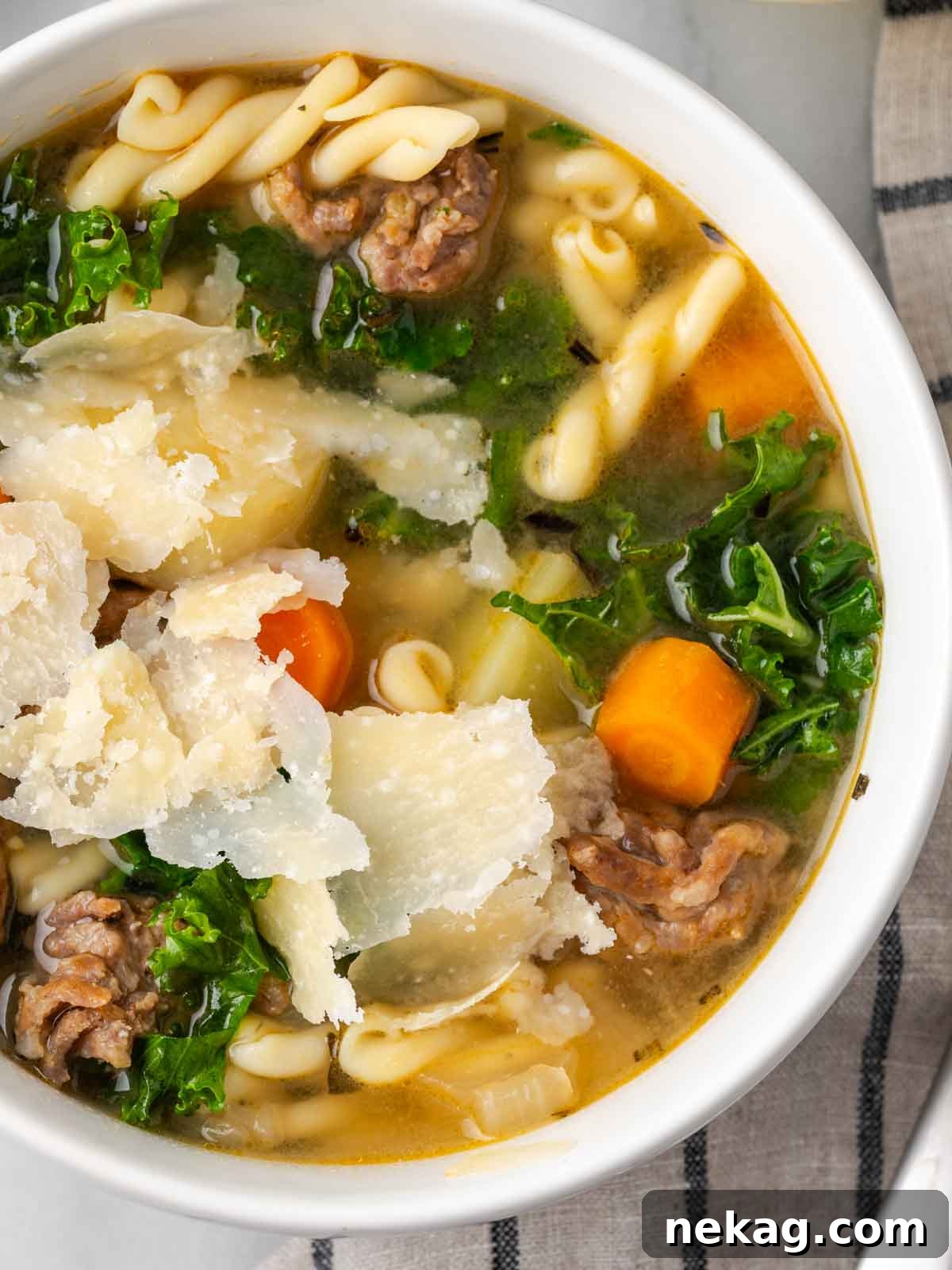 shaved parmesan on kale soup.