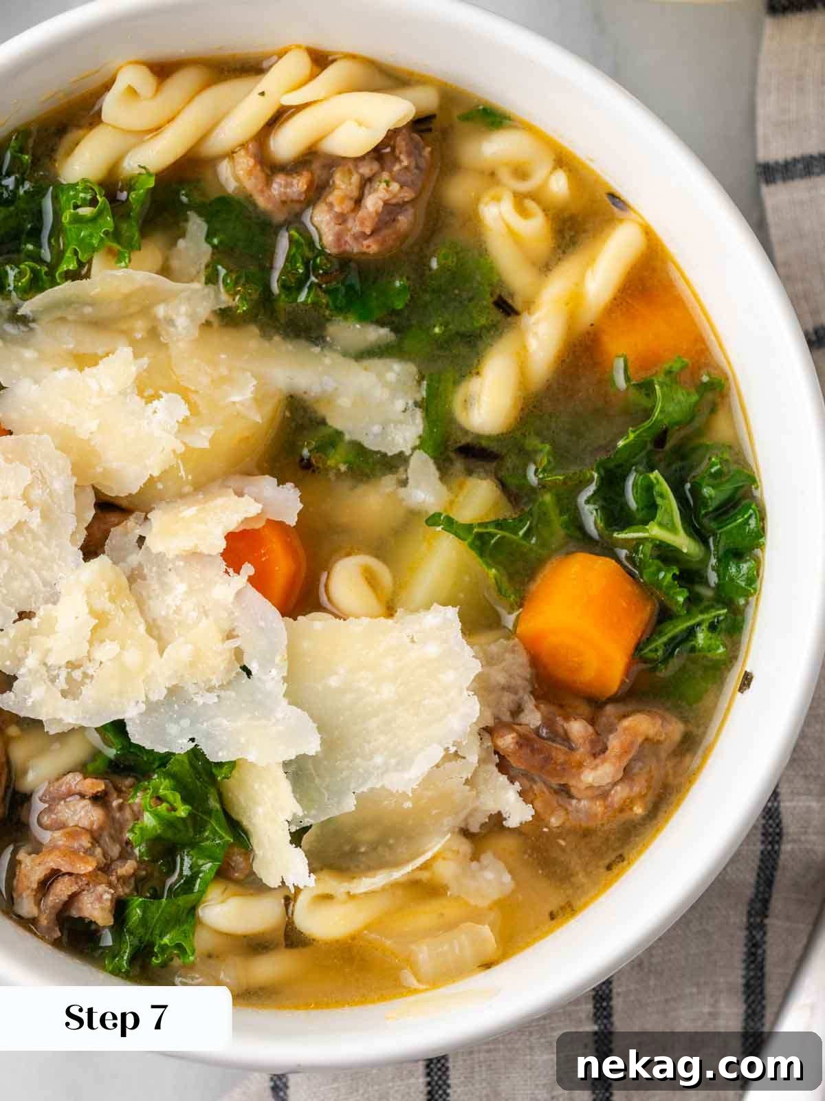 soup in bowl with green kale.