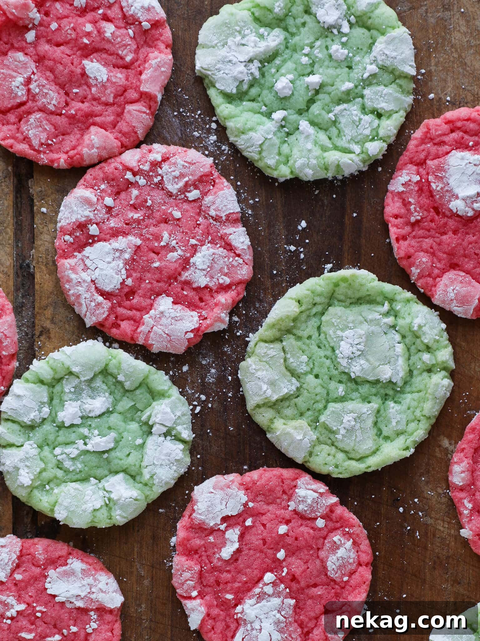 Festive Almond Crinkle Cookies arranged on wooden surface easy Christmas cookies.