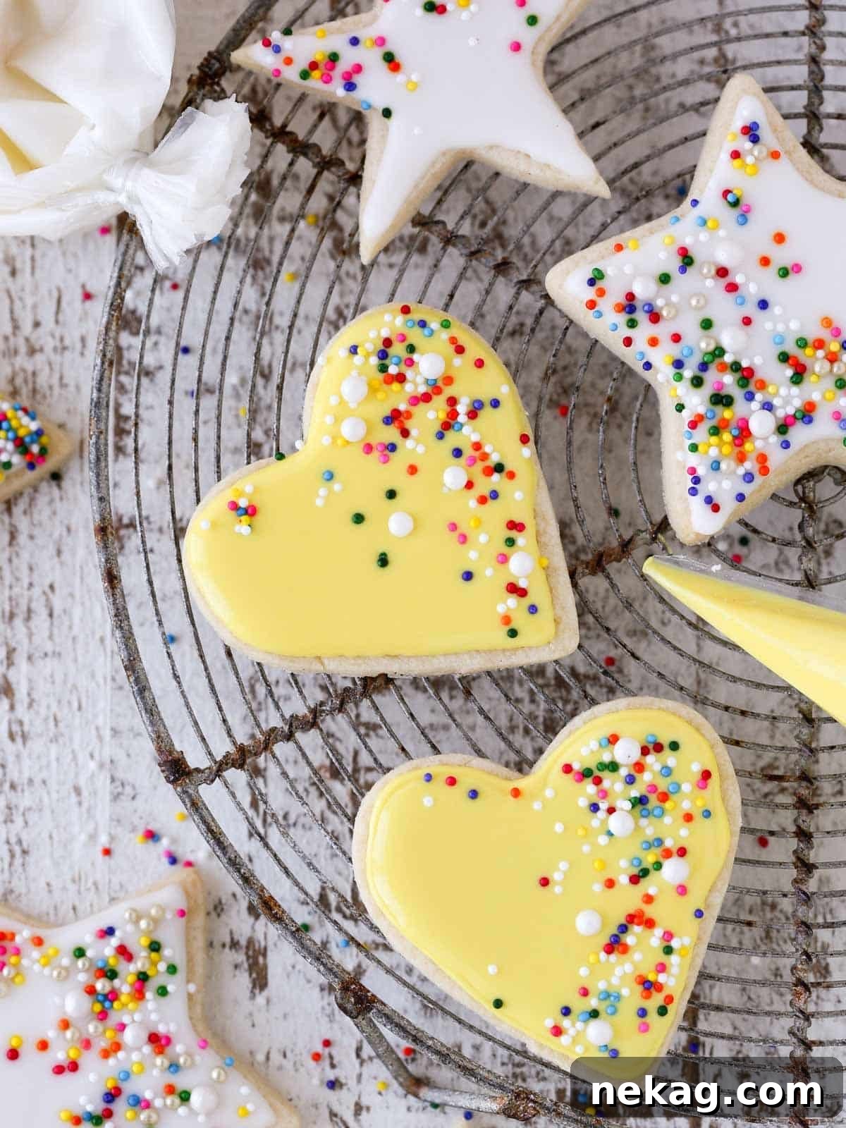 sugar cookies decorated with royal icing white and yellow.
