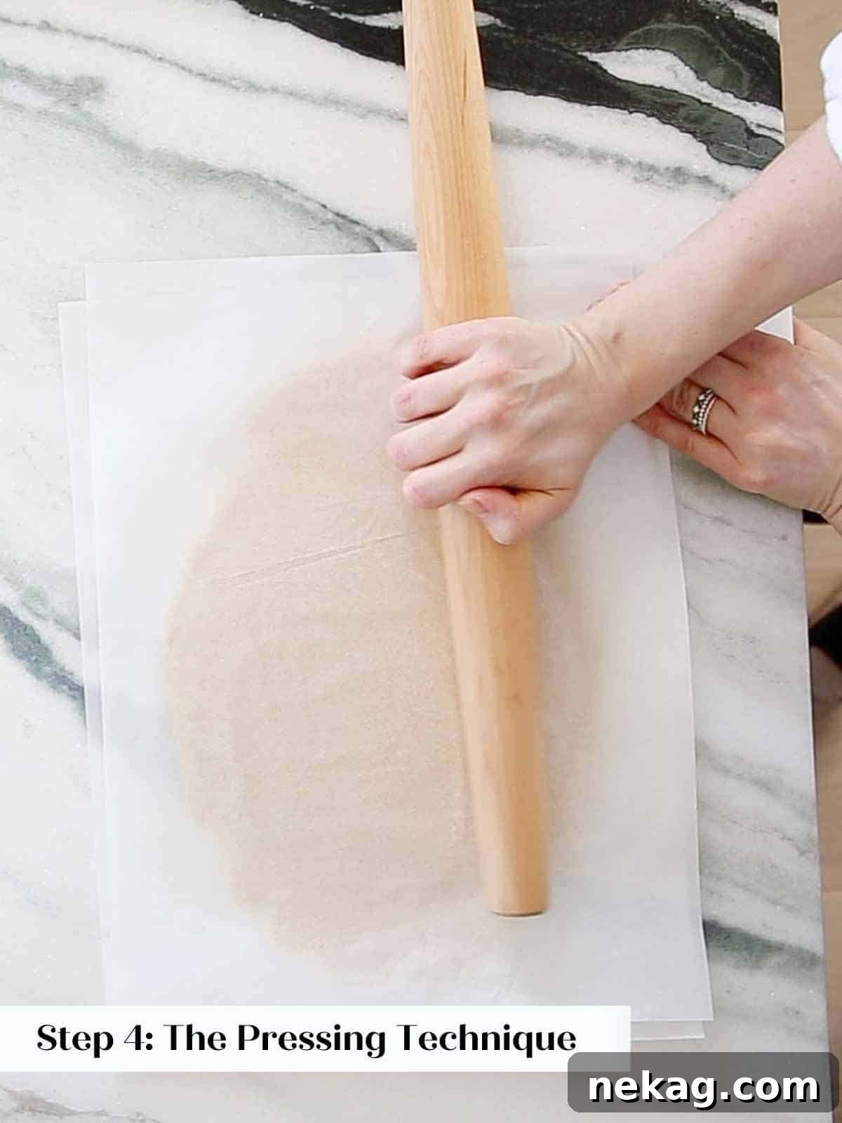 pressing dough with rolling pin to smooth and flatten.