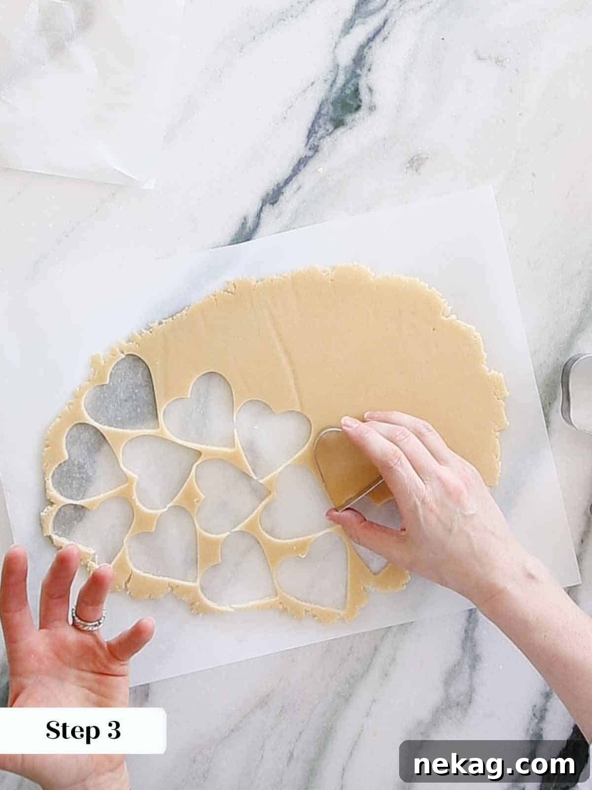 cutting sugar cookie hearts.