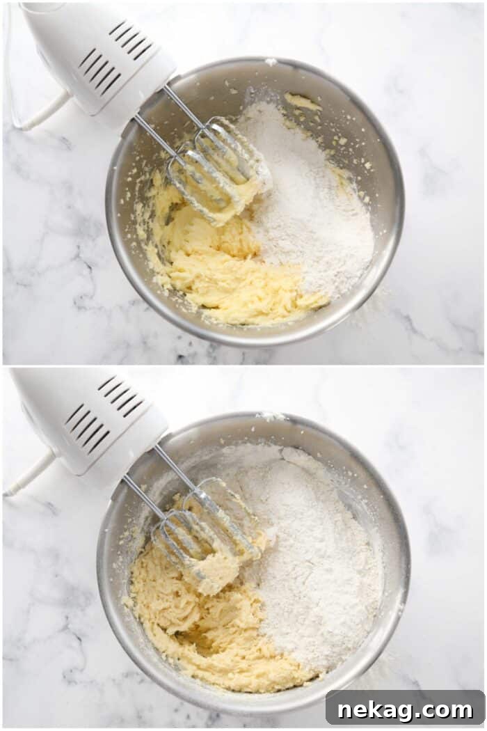 Adding dry ingredients to wet mixture in a bowl with an electric hand mixer.