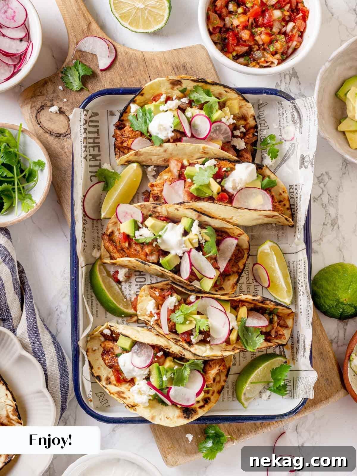 Zesty Chicken Taco Fiesta 13 Fully assembled chicken tacos with various toppings.
