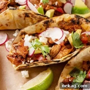 Chicken tacos with chopped chicken.