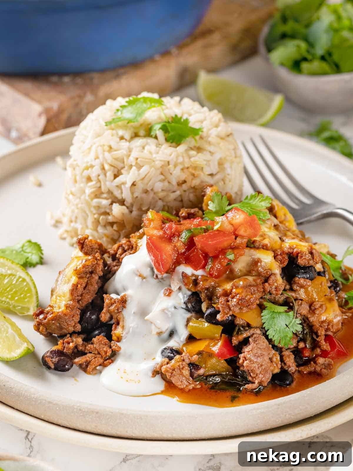 A serving of the healthy taco bake alongside a bed of brown rice, showcasing its hearty and satisfying nature.