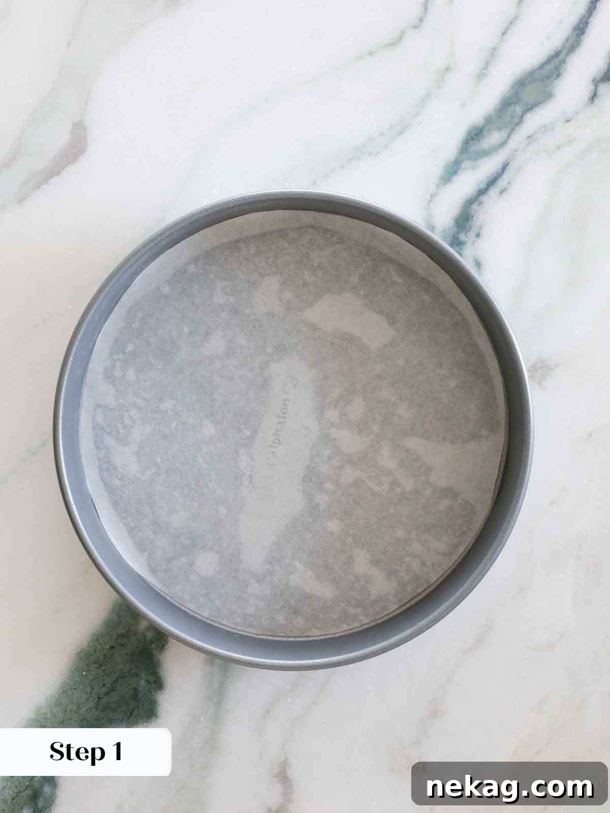 Sun-Kissed Lemon Olive Oil Cake 7 round cake pan lined with parchment.
