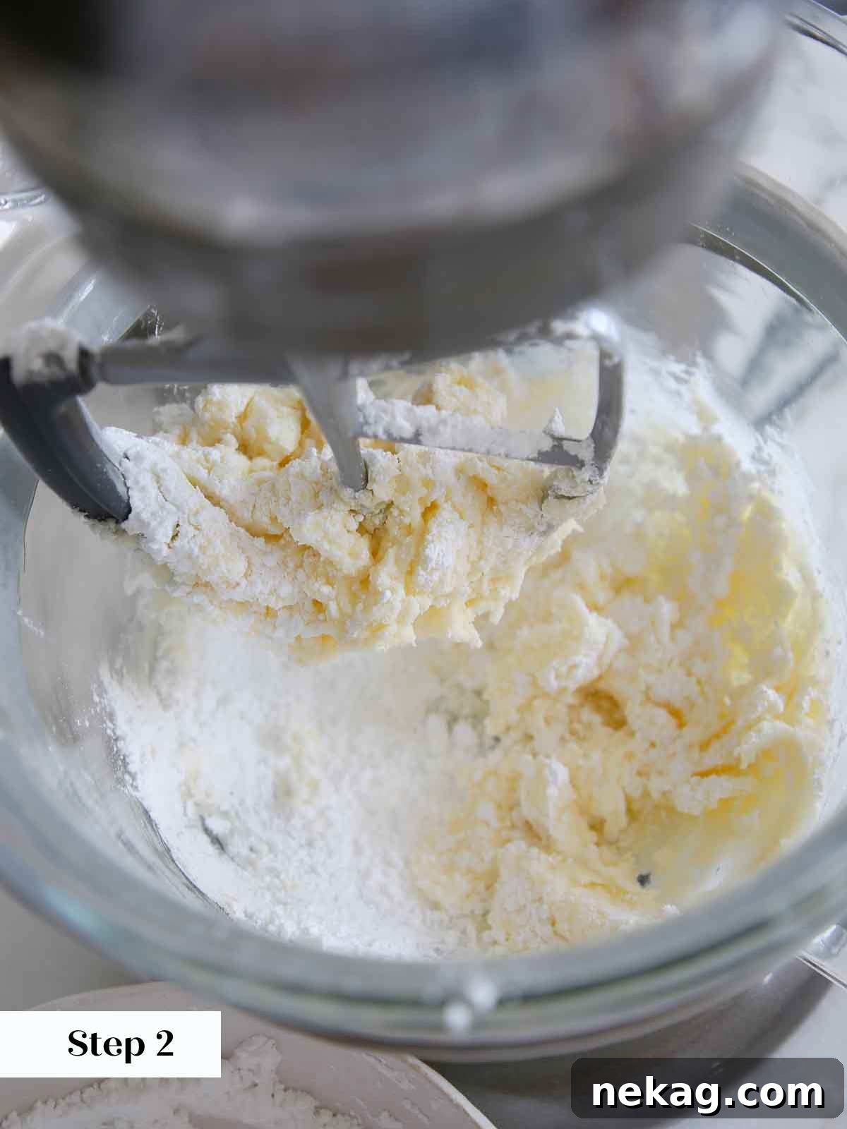 Perfectly Moist Vanilla Cake 17 mixing powdered sugar and butter for vanilla buttercream.