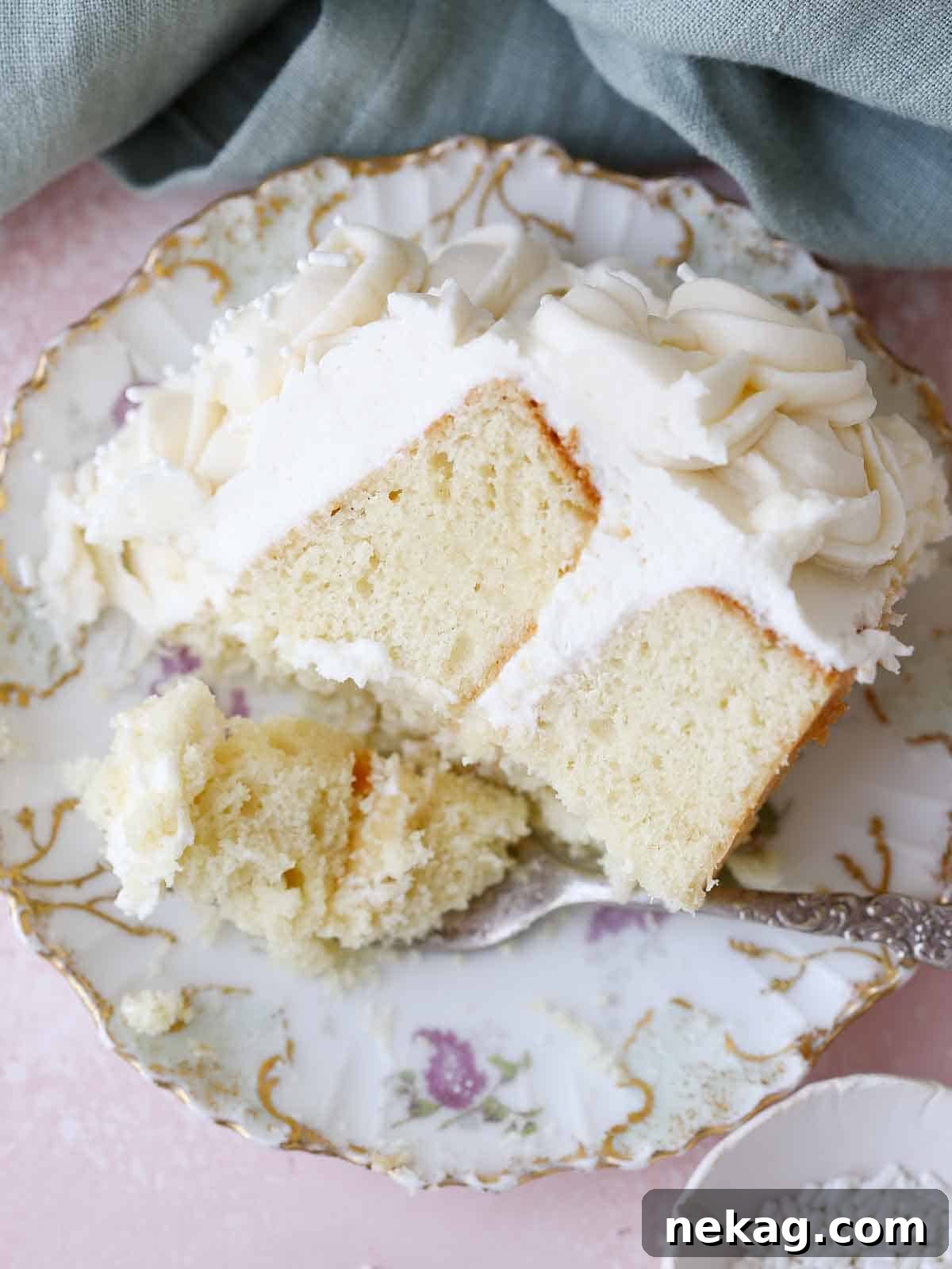 Perfectly Moist Vanilla Cake 28 slice of moist vanilla cake on vintage purple plate.