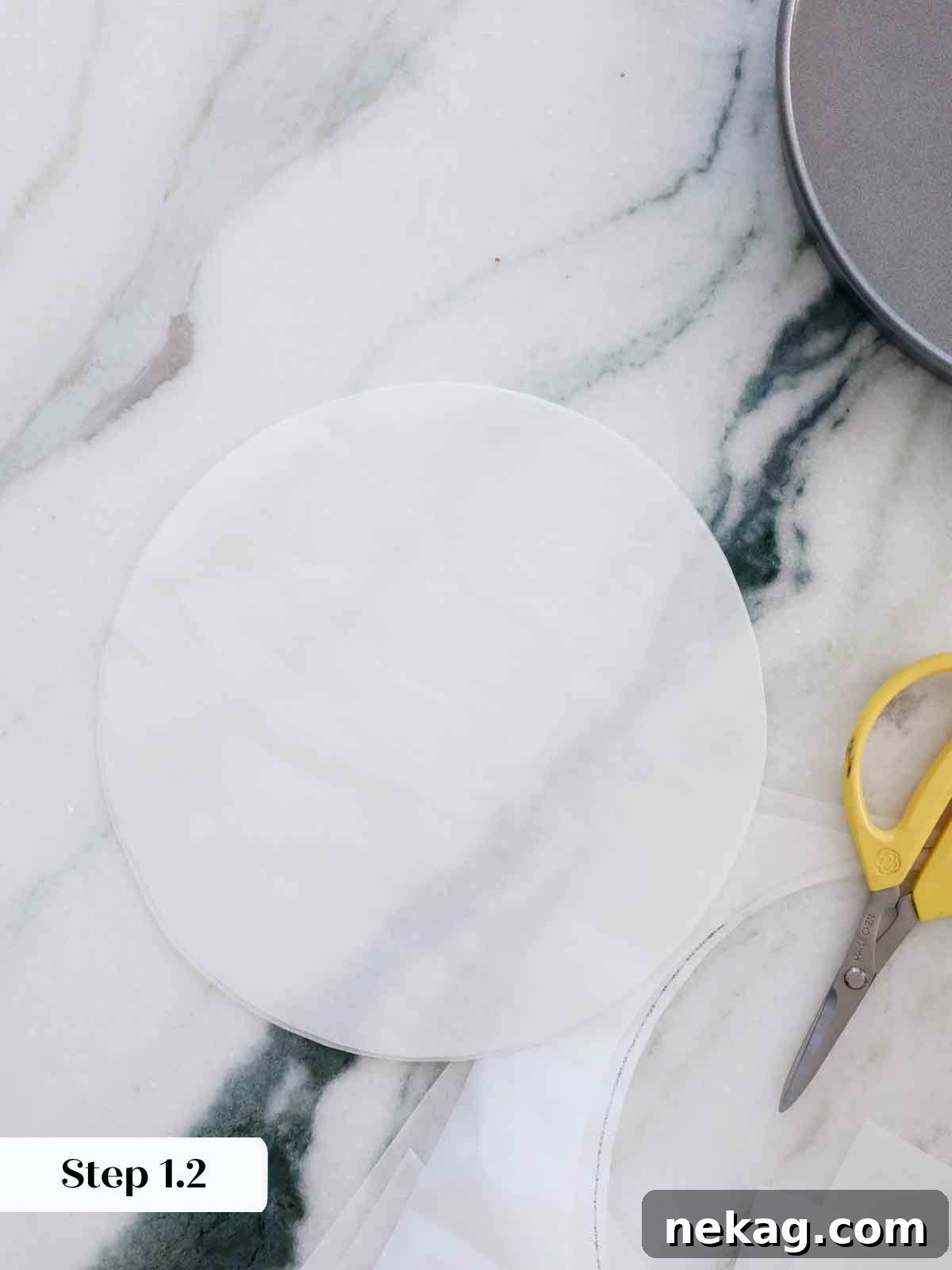Perfectly Moist Vanilla Cake 9 cutting parchment circles to line cake pans.