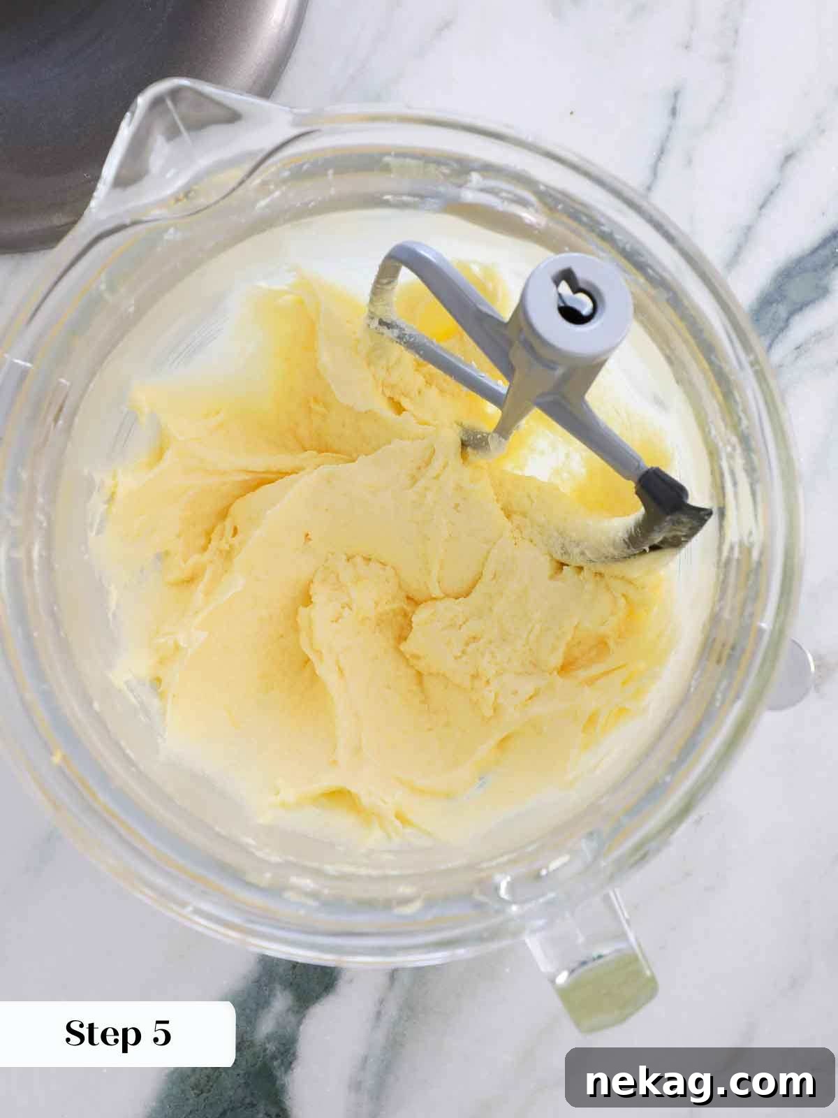 Sunshine Lemon Cupcakes 10 Creamed batter after eggs have been added, showing a smooth and well-incorporated mixture for lemon cake.